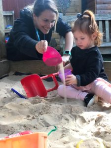 child-playing-with-sand
